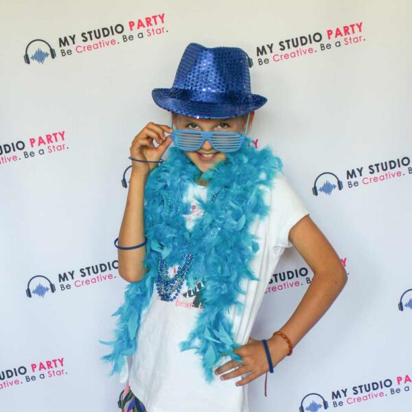Girl dressed in blue accessories at superstar birthday party with My Studio Party