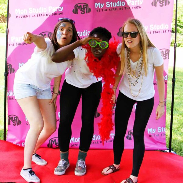 Teen girls having fun on My Studio Party's red carpet at the Teen Birthday Party Package