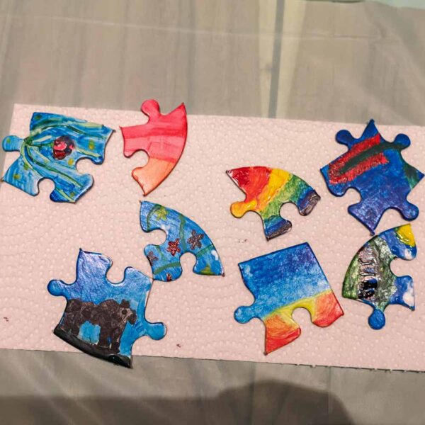Pieces of a painted puzzle made by My Studio Party Paint Star Birthday Party