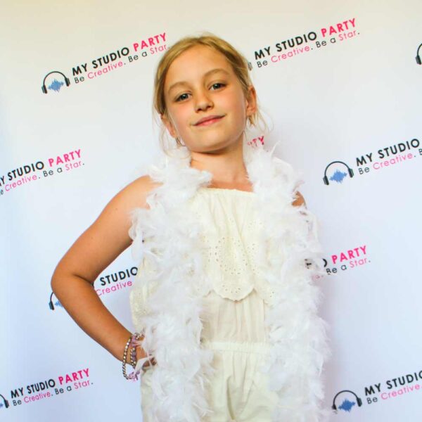 Girl posing on the red carpet with accessories at My Studio Party photoshoot