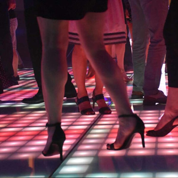 Dance fever party on illuminated floors