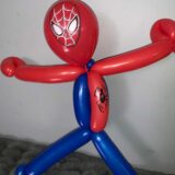 balloon twisting spiderman with hands extended