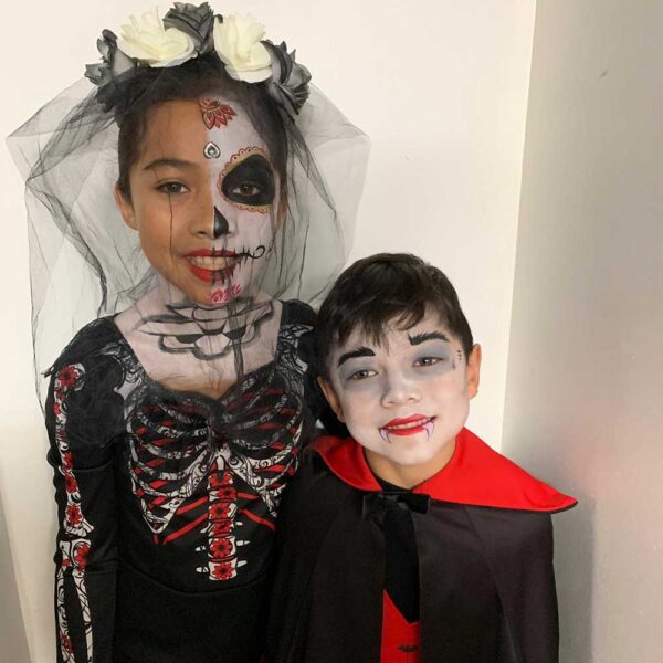 dracula boy and coco face painting girl