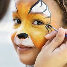 young girl with car face painting