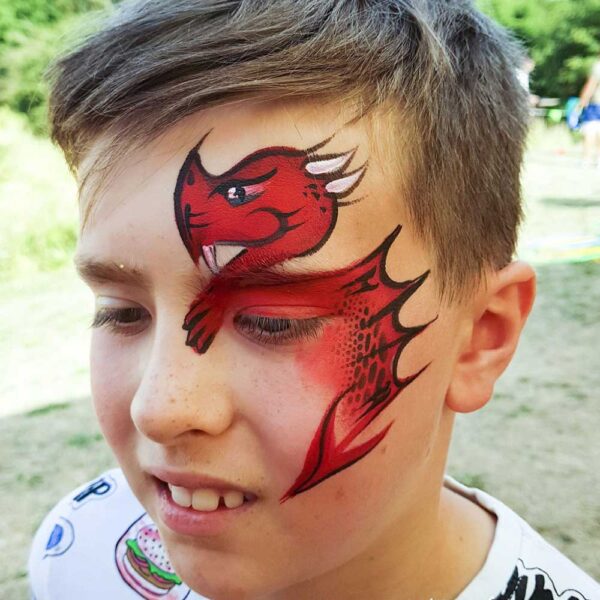 boy with red dragon face painting