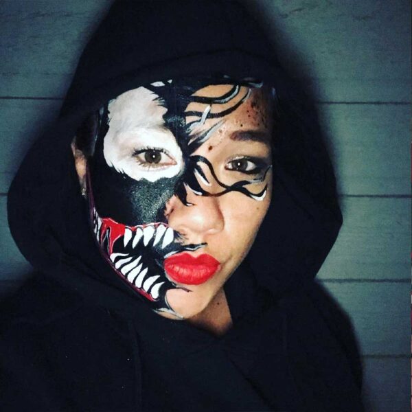 teenager with balck face painting