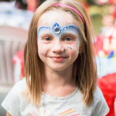 young girl with elsa face painting