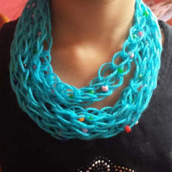 blue finger knitted scarf around girl neck