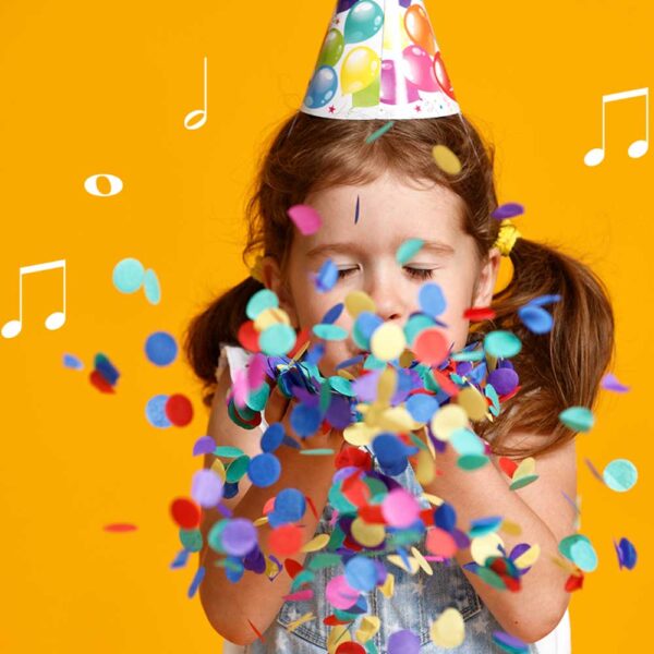 young-girl-blowing-birthday-confetti