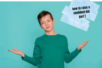 Confident young boy in a green shirt standing with arms out, smiling slightly, with text that reads “how to raise a confident kid part 1” on a blue background.